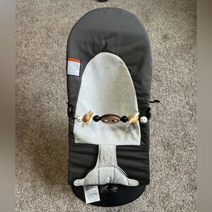 Gray and White Baby Bjorn Bouncer with Toy